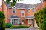 Casement windows Malvern home with garage and drive