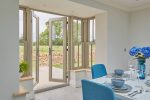 French doors Worcester opening from dining room with table out to garden