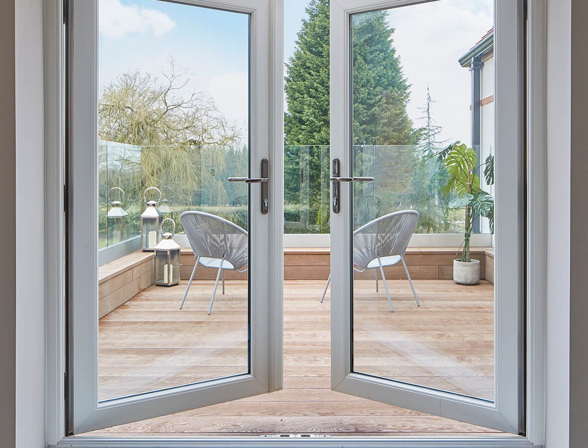 French doors Kidderminster open doors leading out to wooden patio