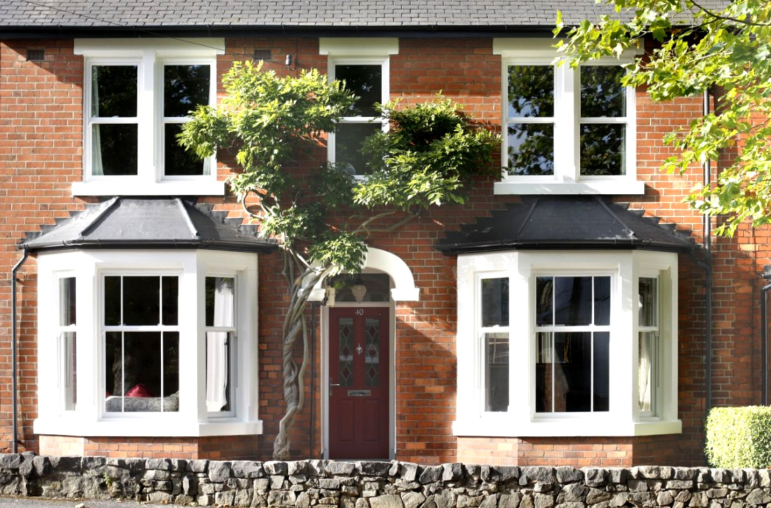 uPVC door in red with decorative glass